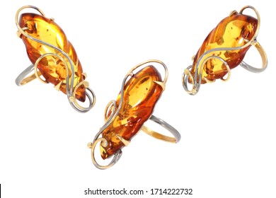 Amber jewelry ring. Natural Baltic amber. Isolated cut out image. Vintage and modern style fashion jewelry.