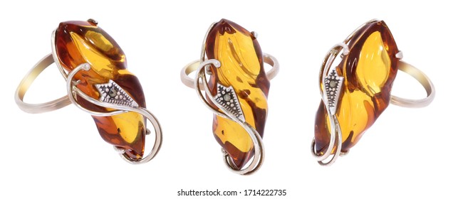 Amber jewelry ring. Natural Baltic amber. Isolated cut out image. Vintage and modern style fashion jewelry.