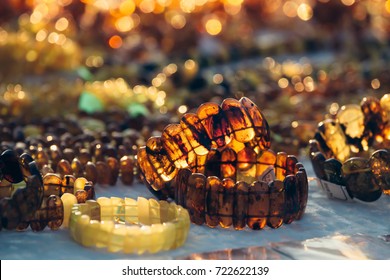 Amber jewels in the sun. Amber bracelets on the market. Gemstone of the Baltic sea.