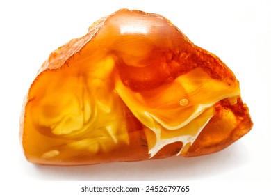 Amber. Landscape  amber  on the white background. Sun stone. Fossil fossilized resin. Semi-precious mineral. Natural material for jewelry. Copal. Science.  Polished amber stone. Patterns