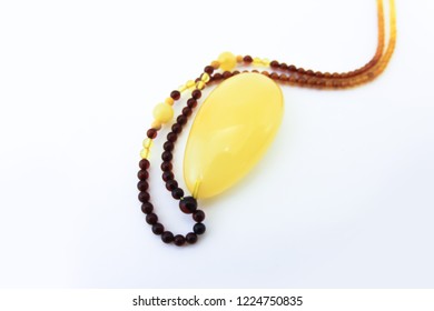 Amber pendant on beads of multi-colored stones