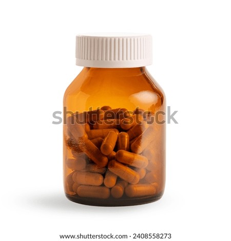 Amber vitamin pills supplement isolated on white background.