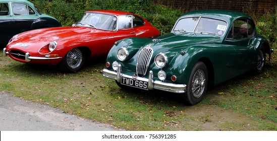 Amberley, UK - 10/08/17: 1967 Jaguar E-type (left) and 1956 Jaguar XK140 at the Amberley Museum & Heritage Centre.