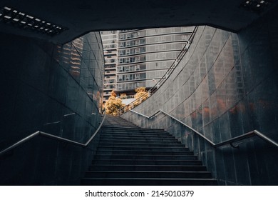 Ambient stairway leading out of a long pedestrian underpass 