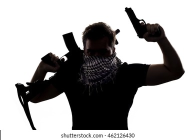 Ambiguous Silhouette Of A Terrorist Or A Soldier With A Rifle And A Handgun.  The Image Depicts Home Grown Terrorist Or An Anonymous Special Operations Agent.