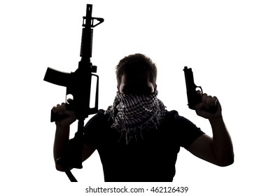 Ambiguous Silhouette Of A Terrorist Or A Soldier With A Rifle And A Handgun.  The Image Depicts Home Grown Terrorist Or An Anonymous Special Operations Agent.