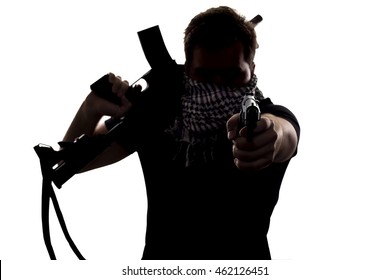 Ambiguous Silhouette Of A Terrorist Or A Soldier With A Rifle And A Handgun.  The Image Depicts Home Grown Terrorist Or An Anonymous Special Operations Agent.