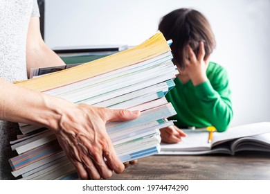 Ambitious Parenting With High Academic Achievement Expectations From Kids Concept. A Mother Is Bringing A Pile Of Test Prep Books To Her Bored, Tired Kid Who Is Crying And Protesting During Homework