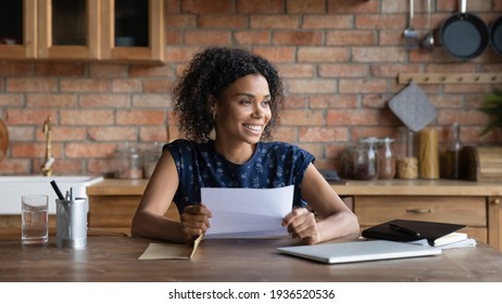 Ambitious Young Biracial Woman Get Loan Approval Paper Letter From Bank Dream Of New Opportunity. Happy Black Female Small Business Owner Receive Good News By Mail In Financial Report Think Of Profit