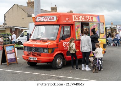 Amble, Northumberland, UK: May 22nd, 2022: People Queueing At An Ice Cream Van At The Harbour.