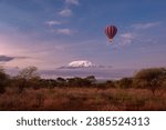 Amboseli National Park with view on snow summit of Kilimanjaro in Kenya. Safari Hot air ballon experience in early morning