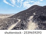 Amboy Crater in southern California is an ancient volcano which measures out to 1,500 ft in diameter. It