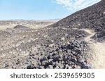 Amboy Crater in southern California is an ancient volcano which measures out to 1,500 ft in diameter. It