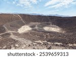 Amboy Crater in southern California is an ancient volcano which measures out to 1,500 ft in diameter. It