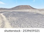 Amboy Crater in southern California is an ancient volcano which measures out to 1,500 ft in diameter. It