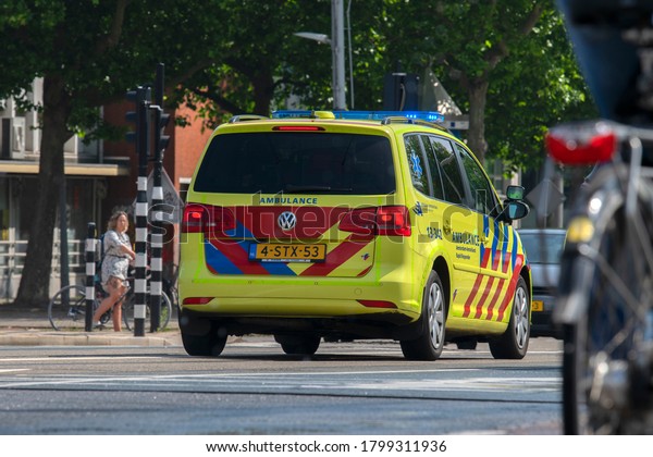 Ambulance Car In Busy Traffic Situation At\
Amsterdam The Netherlands\
12-6-2020
