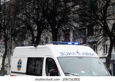 Ambulance Car With Flashing Lights On The Roof On City Street At Daytime. Ukraine, Zhytomir, December, 3, 2021