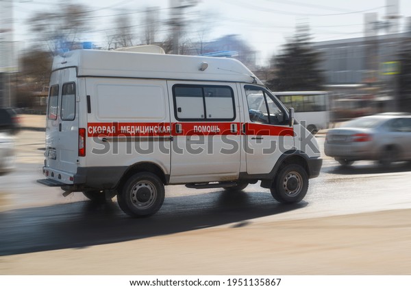 Ambulance\
car with flashing lights and sirens driving in the city. Fast\
response machine. Smolensk, Russia\
04.07.2021