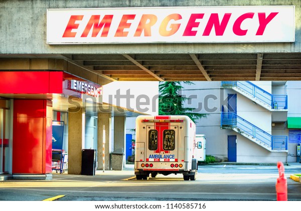 Ambulance\
car in front of emergency entrance.\
A modern ambulance car parked\
near the emergency entrance to the hospital in the daytime and\
ready to go to the rescue on call at any\
time