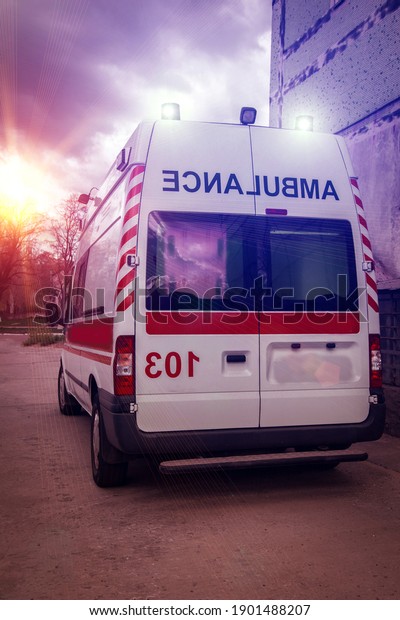  ambulance car on blured background\
at sunset. Ambulance auto paramedic emergency.\
