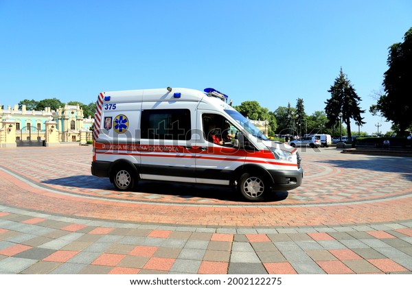 An\
ambulance car is on duty at rally near Ukrainian parliament,\
Verkhovna Rada. Ambulance is providing assistance in treatment of\
covid-19 coronavirus. Kyiv, Ukraine,\
2021-06-15