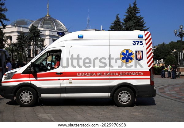 An\
ambulance car is on duty at rally near Ukrainian parliament,\
Verkhovna Rada. Ambulance is providing assistance in treatment of\
covid-19 coronavirus. Kyiv, Ukraine,\
2021-06-15