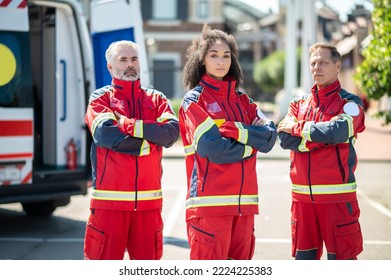 Ambulance Doctors In Uniforms Near An EMS Vehicle