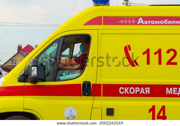 Ambulance. A driver in a medical mask is\
driving. Russia, Sterlitamak.\
28.06.2021