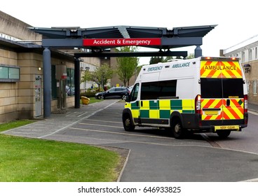 An Ambulance Drives Into An Accident & Emergency Ward Of A Hospital