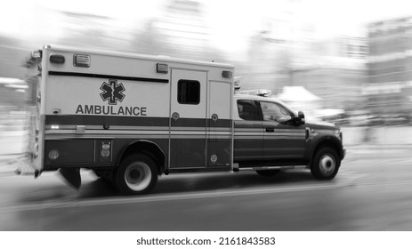 An Ambulance Is Driving Down The Street