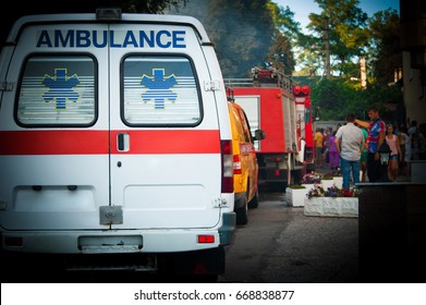 Ambulance, Fire Truck And Other Emergency Cars In Row - Back View