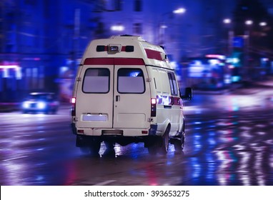 Ambulance Goes On The Night Rainy City