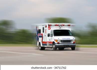 Ambulance In Motion Driving Down Road