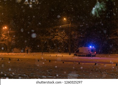 Ambulance On A Winter Road At Night.