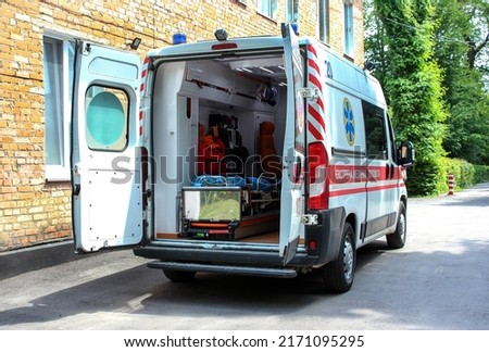 Ambulance with open doors. Emergency equipment and devices, ambulance interior details with necessary patient care equipment. Basic equipment for emergency inside ambulance.