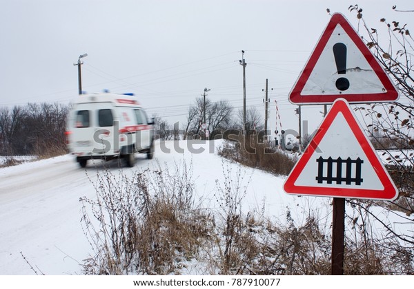 the\
ambulance rushes past the sign railway\
crossing