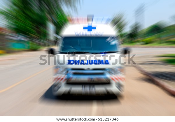 Ambulance speeding to\
accident, Emergency ambulance travels through city street, Zoom\
effect applied for dramatic effect, Ambulance first aid abstract\
motion blur shot.