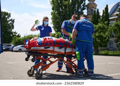 Ambulance staff laid the patient on a vacuum mattress - Powered by Shutterstock