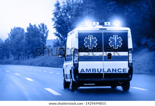 Ambulance van on
highway with flashing
lights
