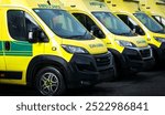 Ambulances - emergency services ambulance vehicles on standby.  The medically equipped transport moves patients with paramedics to a health care facility, such as a hospital, for treatment.