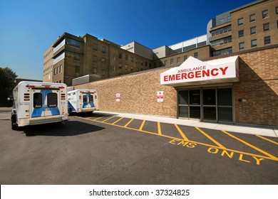 Ambulances wait outside the emergency department of a big city hospital