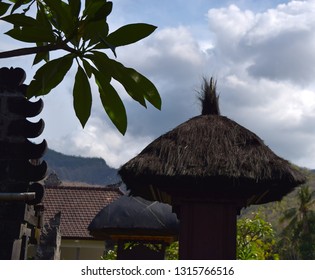 Amed Bali November 2018: Traditional Indonesian roof decorations on cloudy sky background.