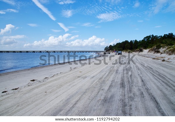 AMELIA ISLAND, FLORIDA, US - OCTOBER 22th, 2017:\
Beach-life on the Fernandina Beach on Amelia island on October 22,\
2017. People often come by car to the beaches to take sunbathe and\
swim in the ocean