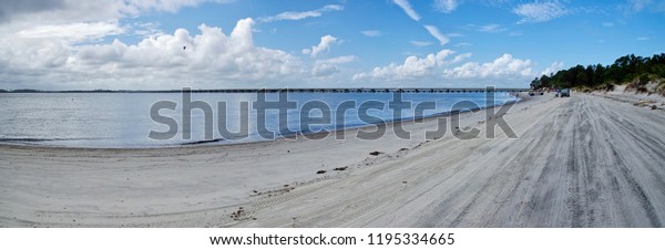 AMELIA ISLAND, FLORIDA, US - OCTOBER 22th, 2017:\
Beach-life on the Amelia island on October 22, 2017. People often\
come by car to the beaches to fishing, take some sunbathe and swim\
in the Atlantic 
