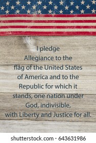 America patriotic message, USA patriotic old flag and weathered wood background with text of the Pledge of Allegiance