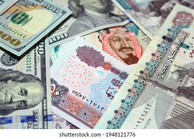 American 100 dollars banknotes , Egyptian 50 pounds, 100 Egyptian pounds banknotes, Saudi Arabia riyals 20 Saudi riyals, multi currencies background, exchange rates of Arabic and American money