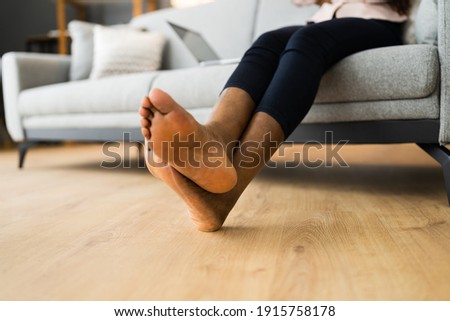 American African Barefoot Woman Legs On Heated Floor