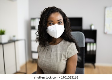 American African Woman At Office Reception In FFP2 Face Mask