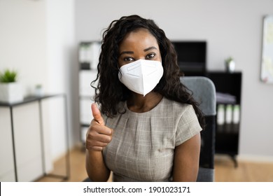 American African Woman At Office Reception In FFP2 Face Mask - Powered by Shutterstock