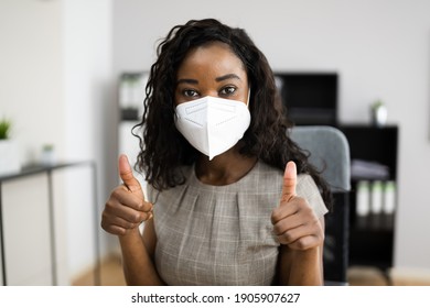 American African Woman At Office Reception In FFP2 Face Mask